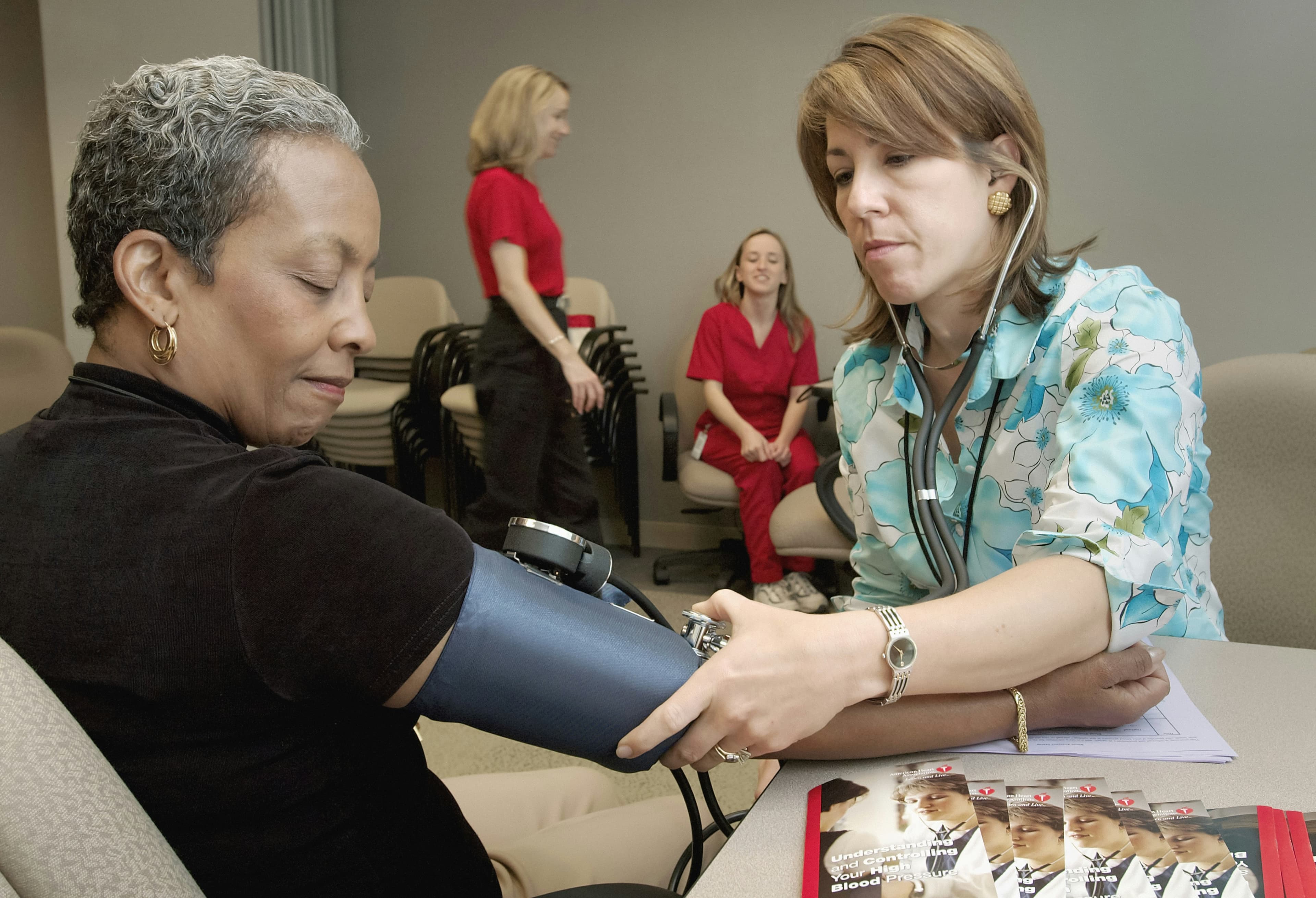 Plasma donor getting blood pressure checked
